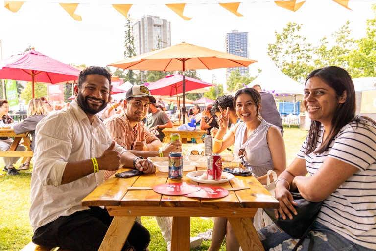 people at picnic table in beer garden