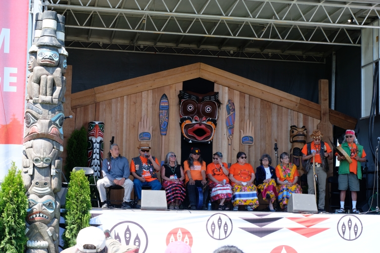 people on stage in Indigenous Village