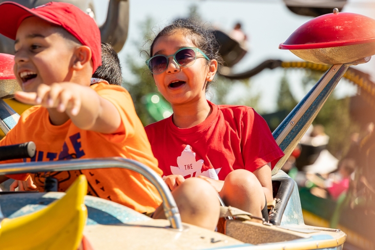 two children on an amusement ride