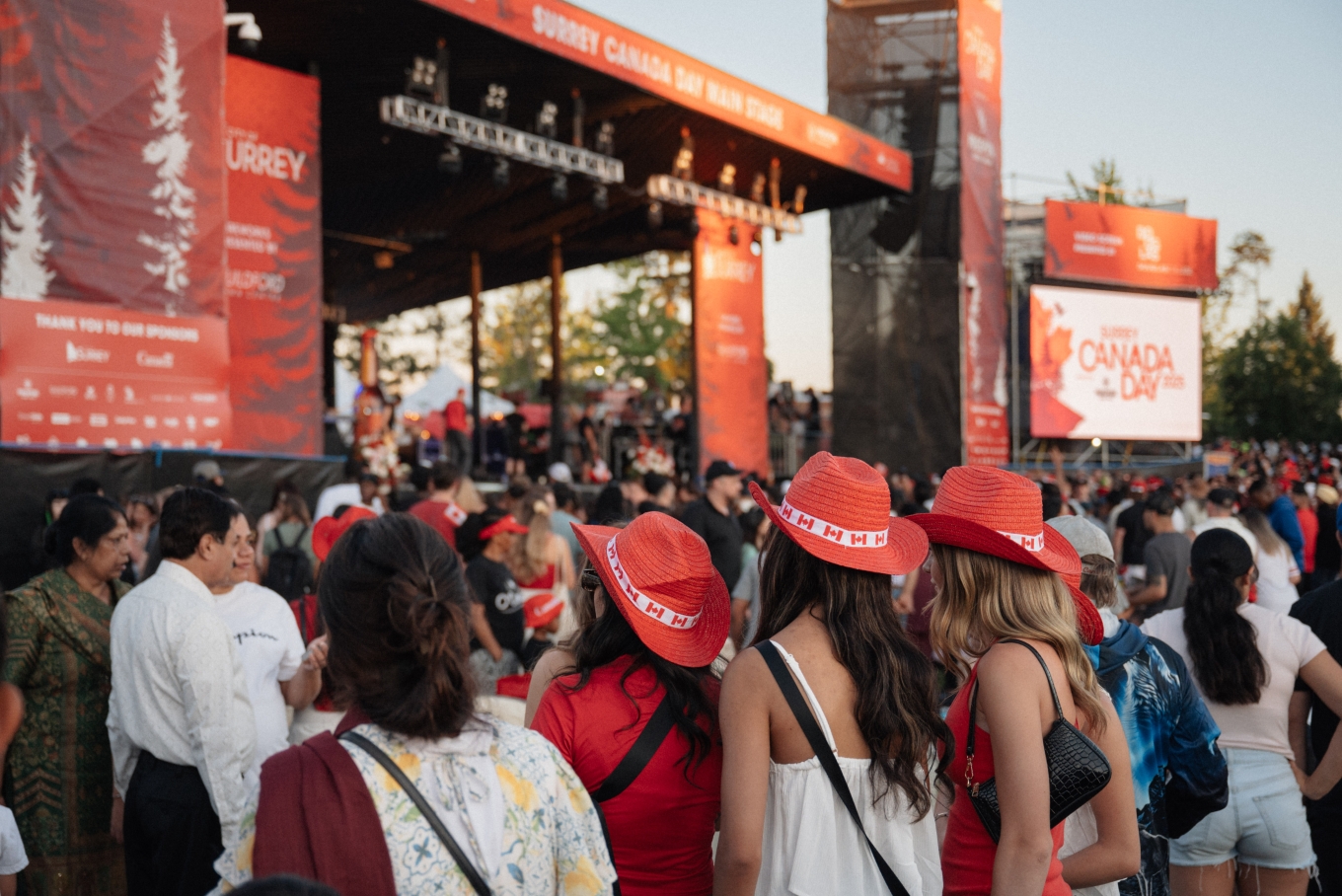 People wearing Canadian hats.